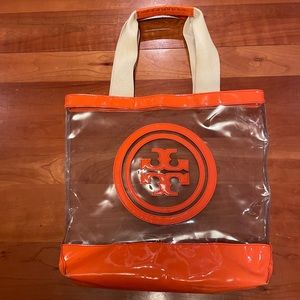 Tory Burch Clear Plastic Tote. Bright
Orange Trim and Accents.